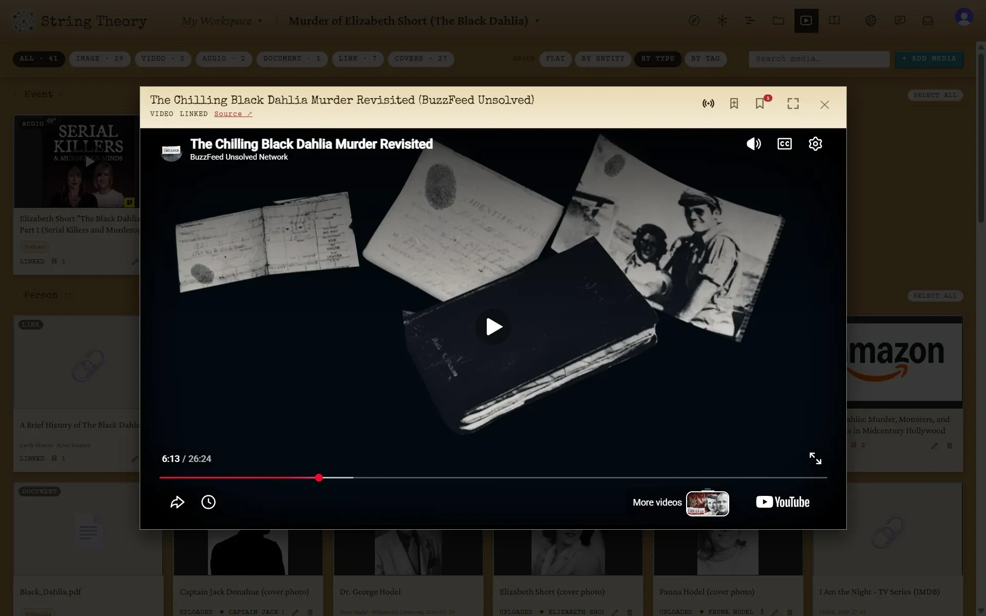 A YouTube video playing inside the media viewer, with a bookmark control in the header.